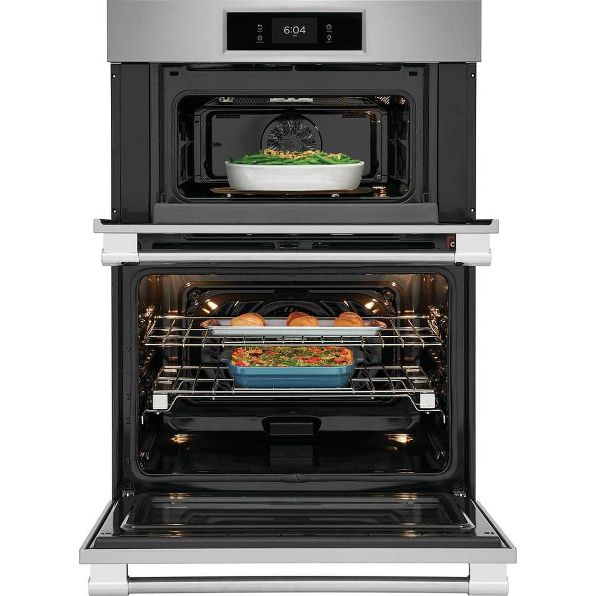 Combination unit showing convection microwave above and large oven below with dishes cooking