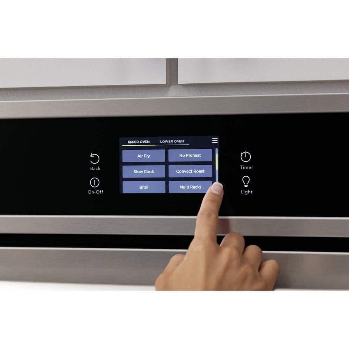 Hand using the wall oven's touch display with cycle buttons like Air Fry and No Preheat