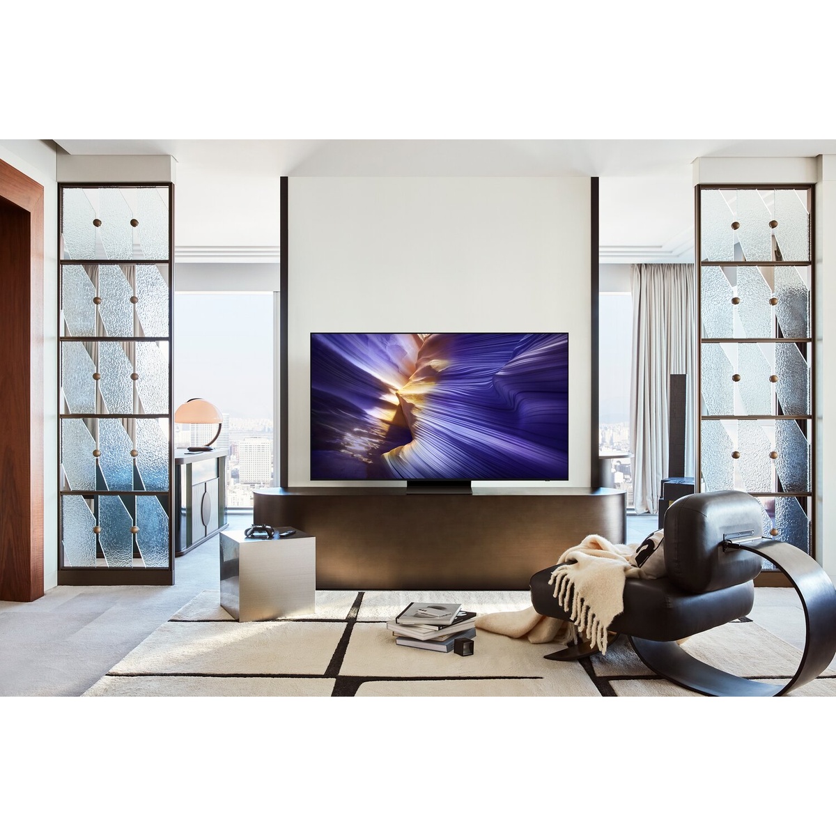 Samsung OLED TV displayed in a modern living room on a stand