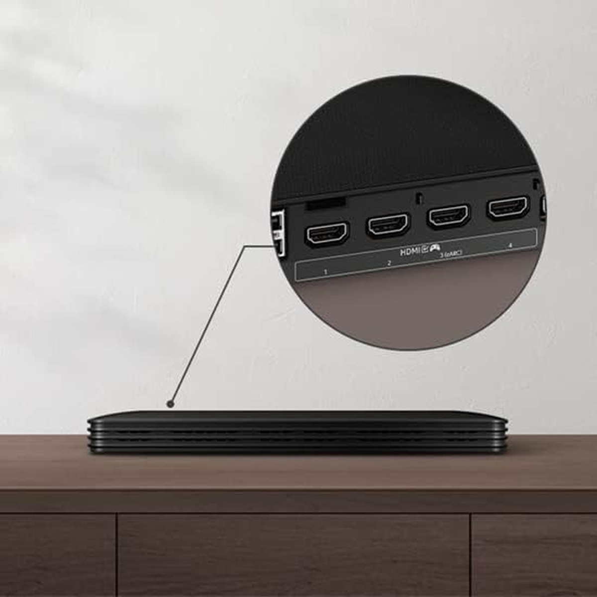 Close-up of the Slim One Connect Box with multiple HDMI ports on a console.