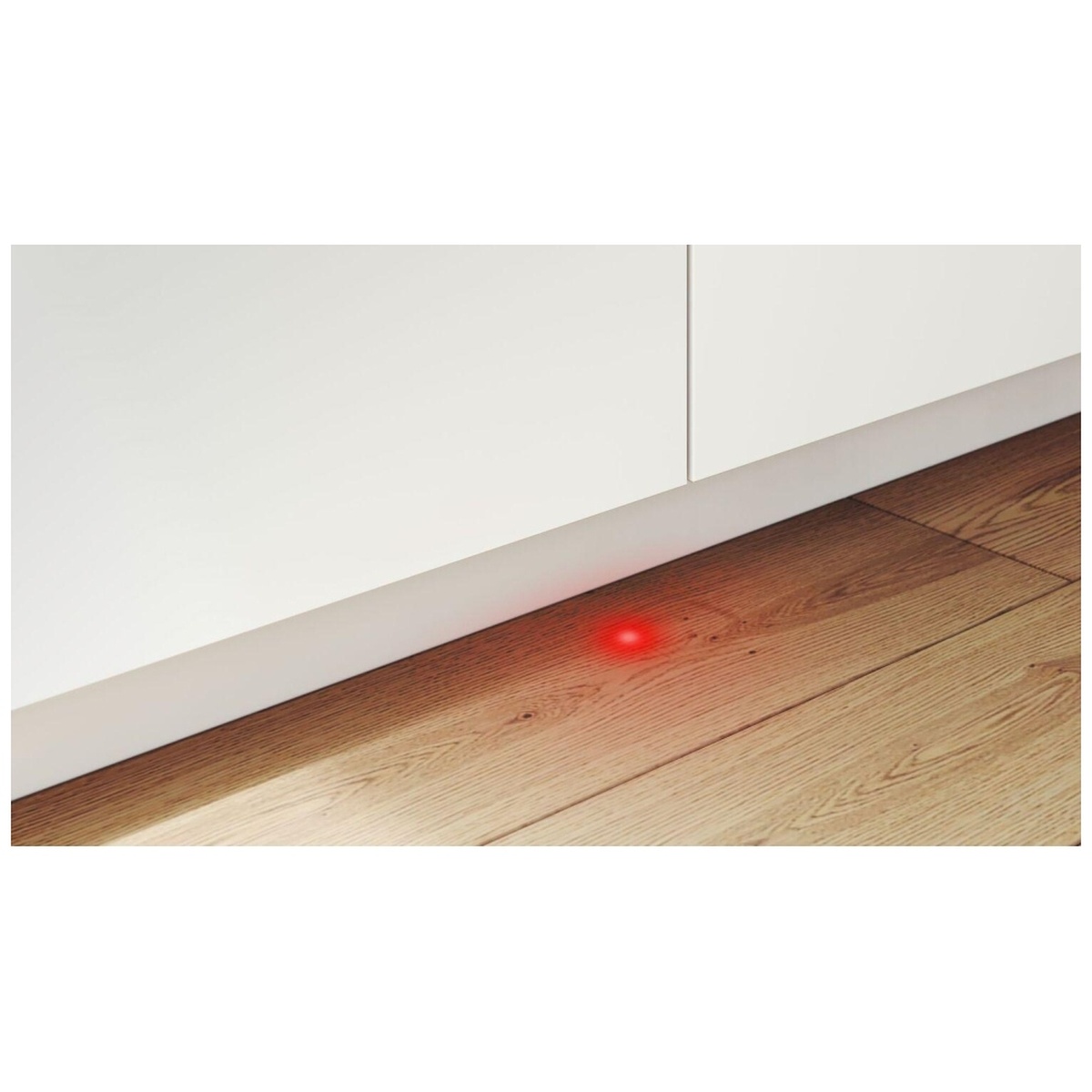 Red InfoLight dot projected onto the kitchen floor from the dishwasher.