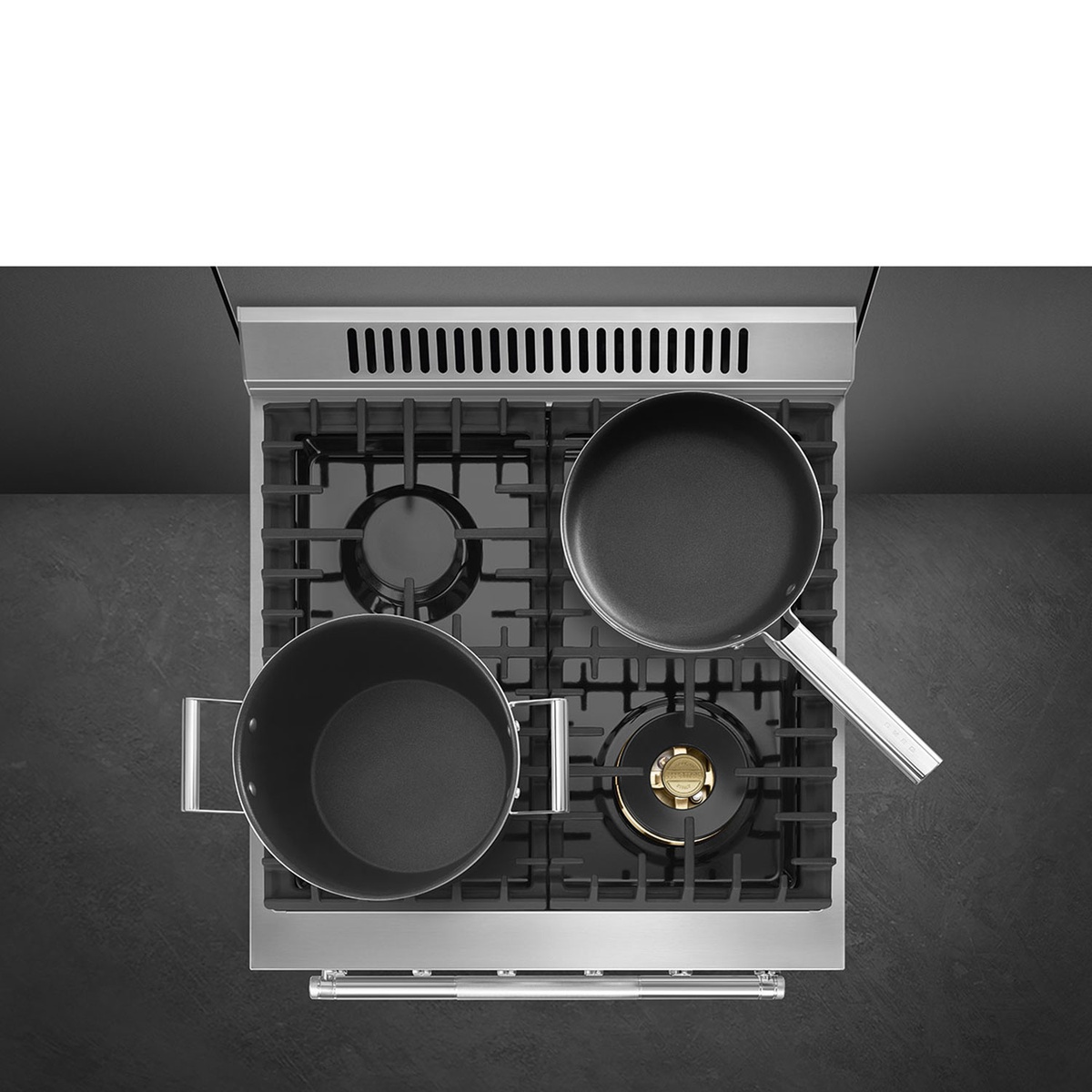 Overhead cooktop view showing pots and pans arranged on continuous grates