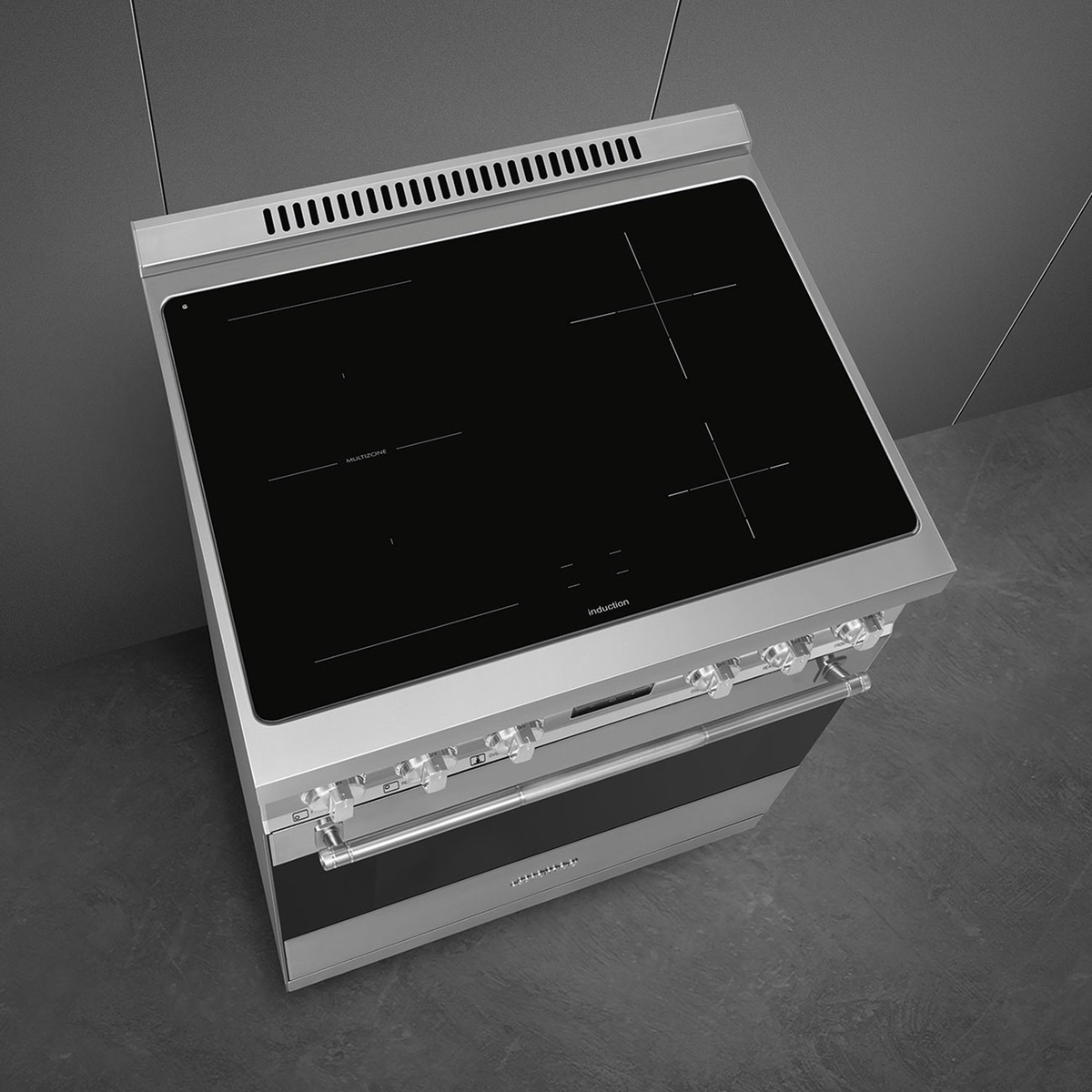 Top view of Smeg SPR30UIMX showing four clearly marked induction zones on a black ceramic surface.