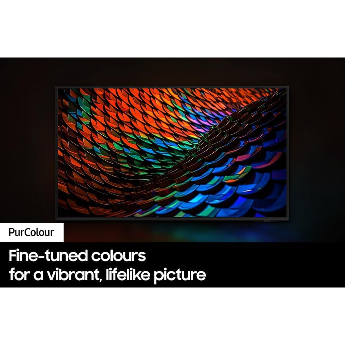 TV screen close-up showing rich multi‑colour PurColor imagery in a dark room