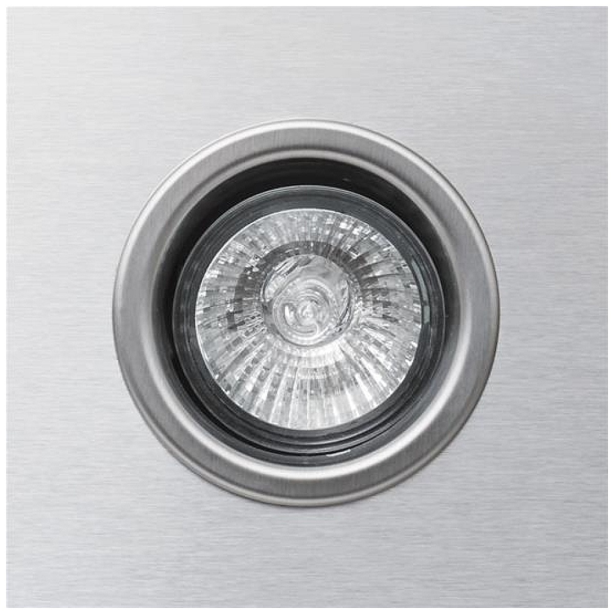 Close-up of the round halogen light recessed in stainless steel