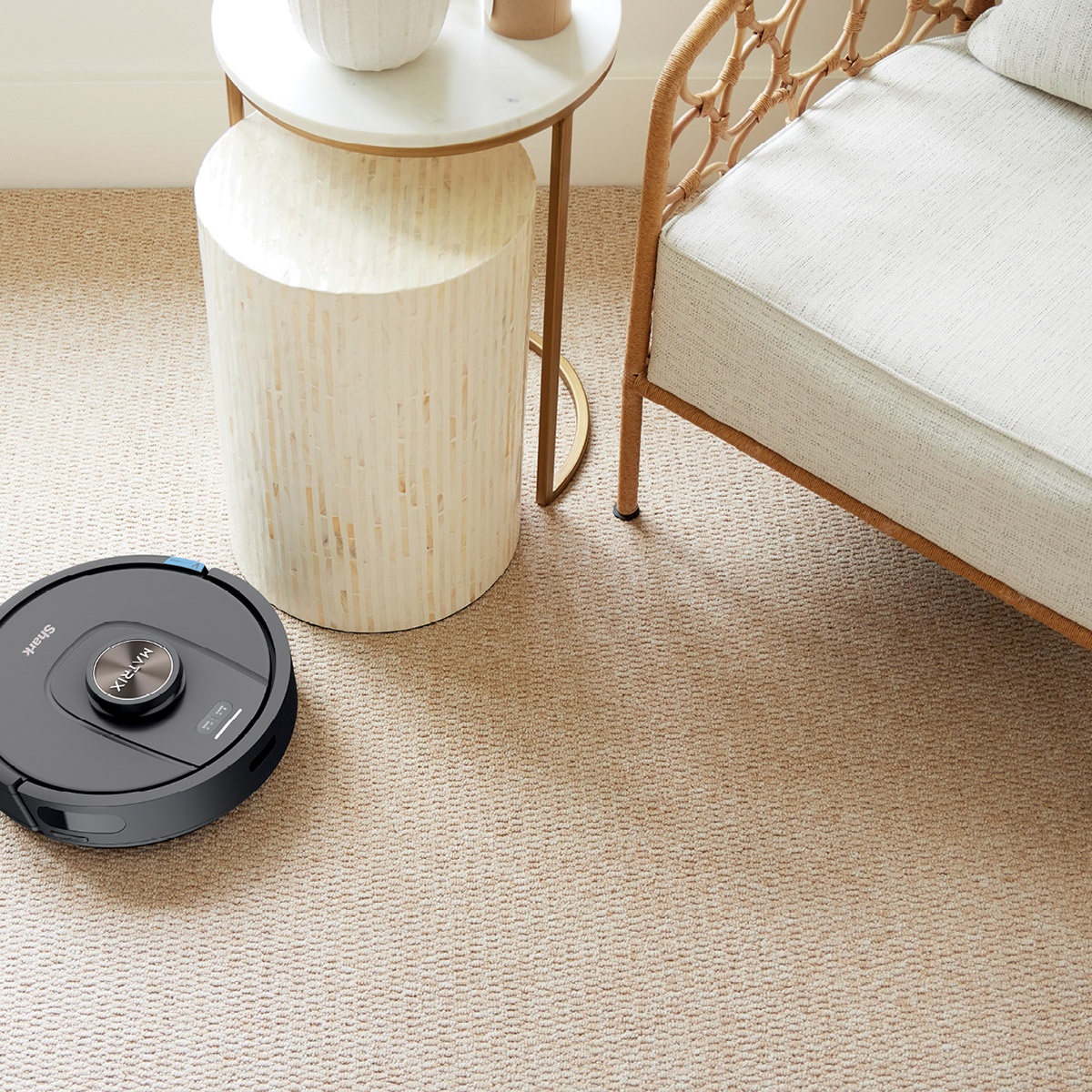 Robot vacuum cleaning a carpeted living space