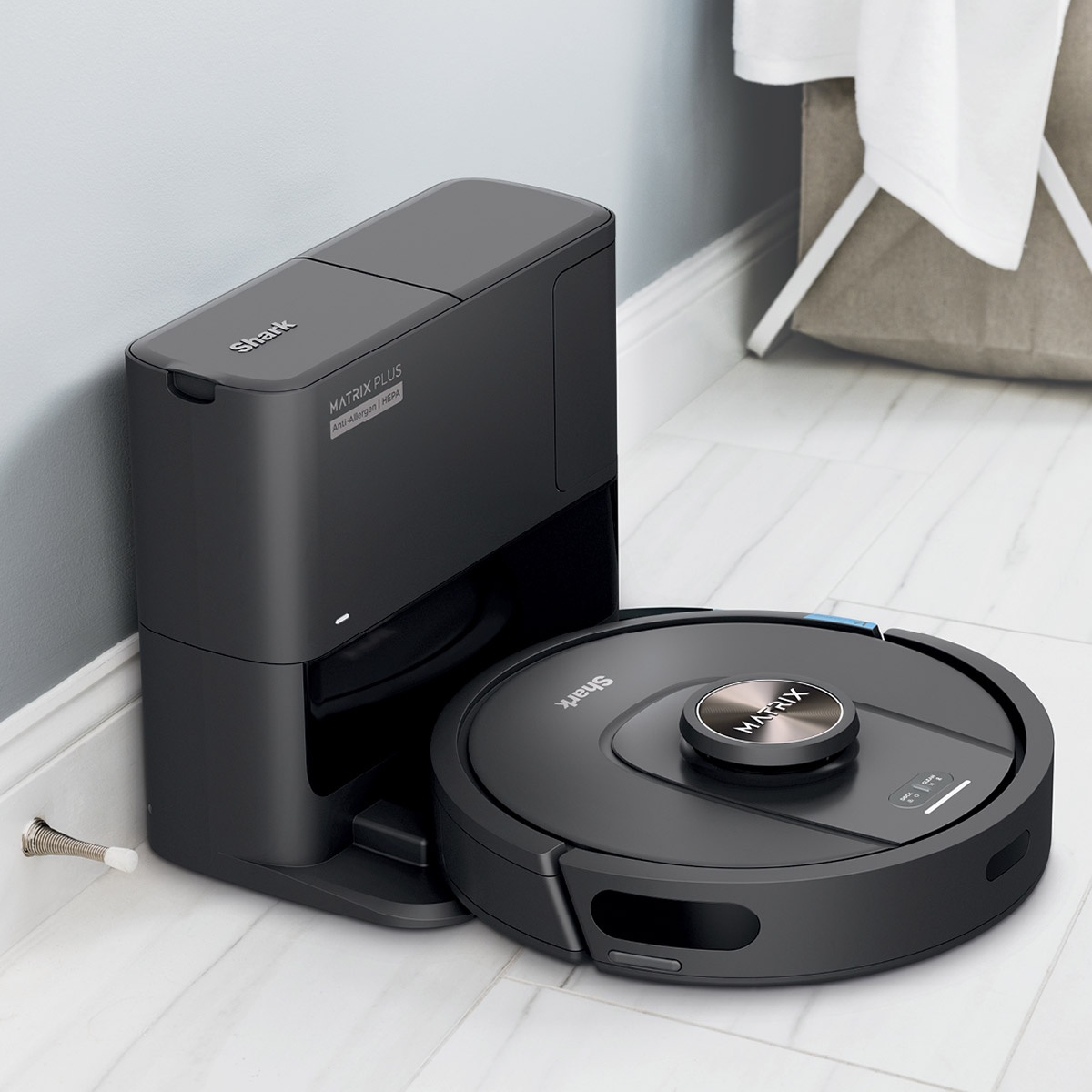 Shark Matrix Plus robot vacuum docked at its self-emptying base