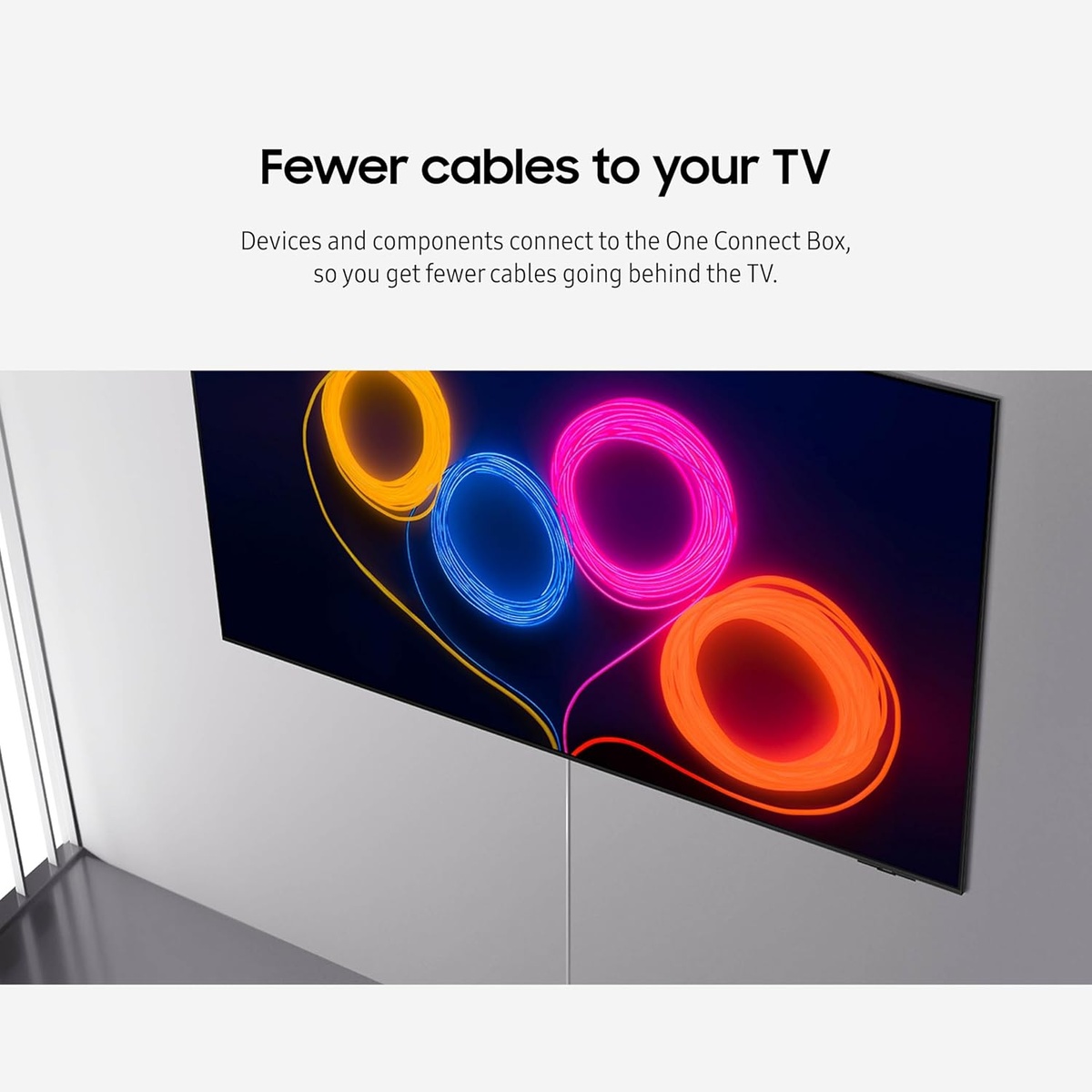 Wall-mounted TV with a single slim cable running down from the screen, highlighting fewer cables.