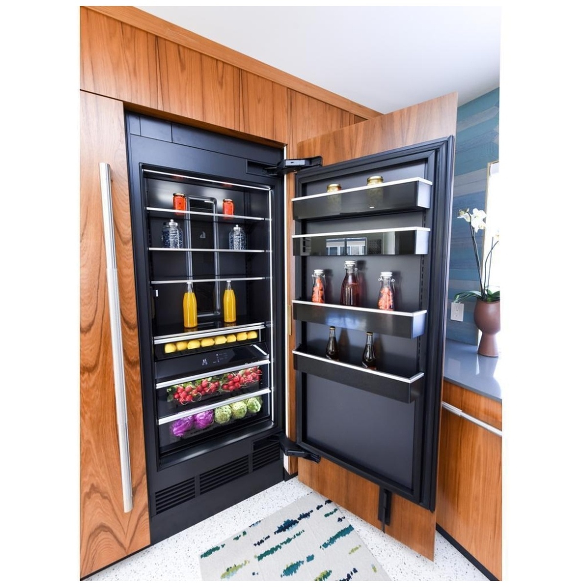 Installed handle on a panel‑ready JennAir column refrigerator in a modern kitchen