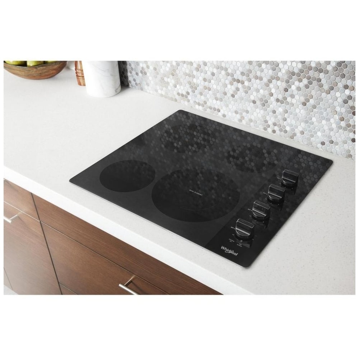 Compact black glass cooktop installed flush in a modern countertop.