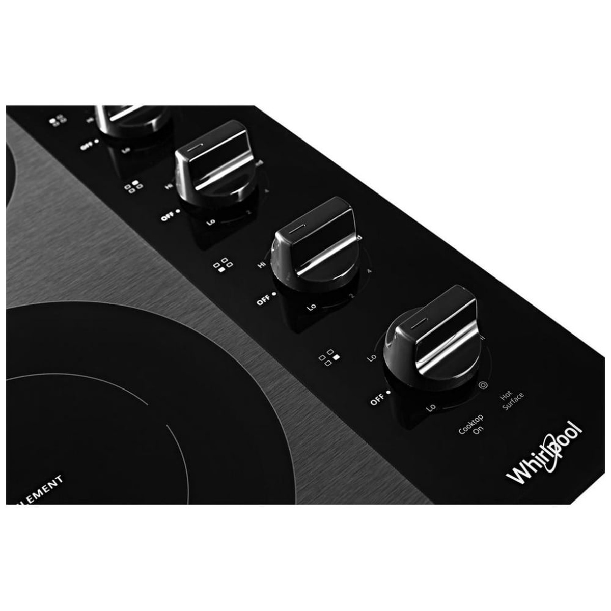 Close-up of Whirlpool cooktop control knobs with indicator icons.