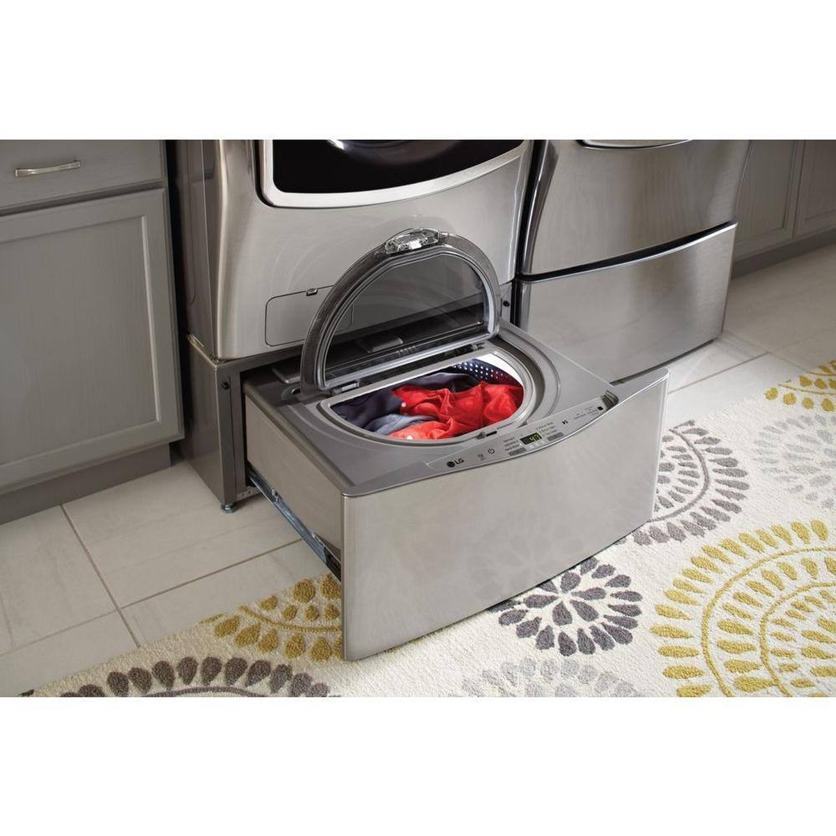 SideKick washer installed beneath an LG front load washer, washing a small load.