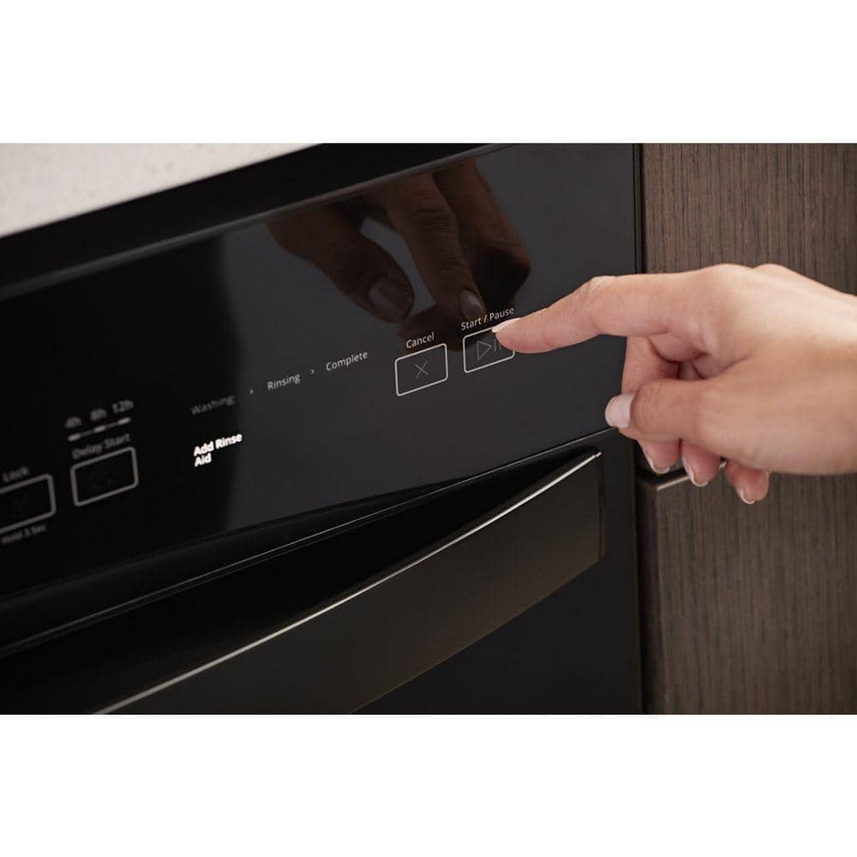 Hand pressing Start on the dishwasher's front controls.