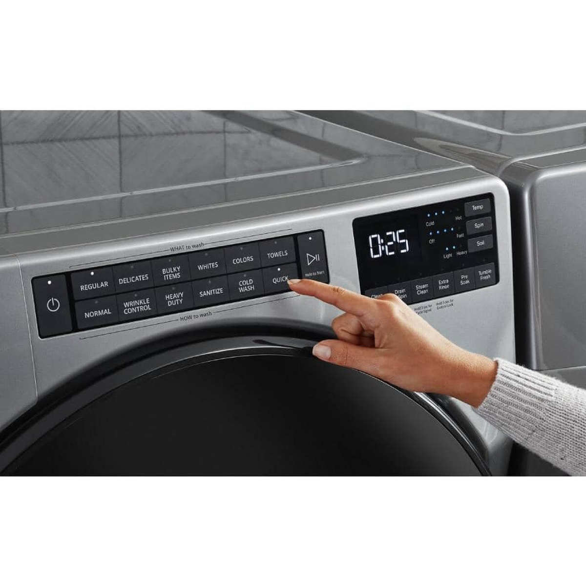 Intuitive control panel of the Whirlpool front-load washer with a hand selecting Quick Wash.