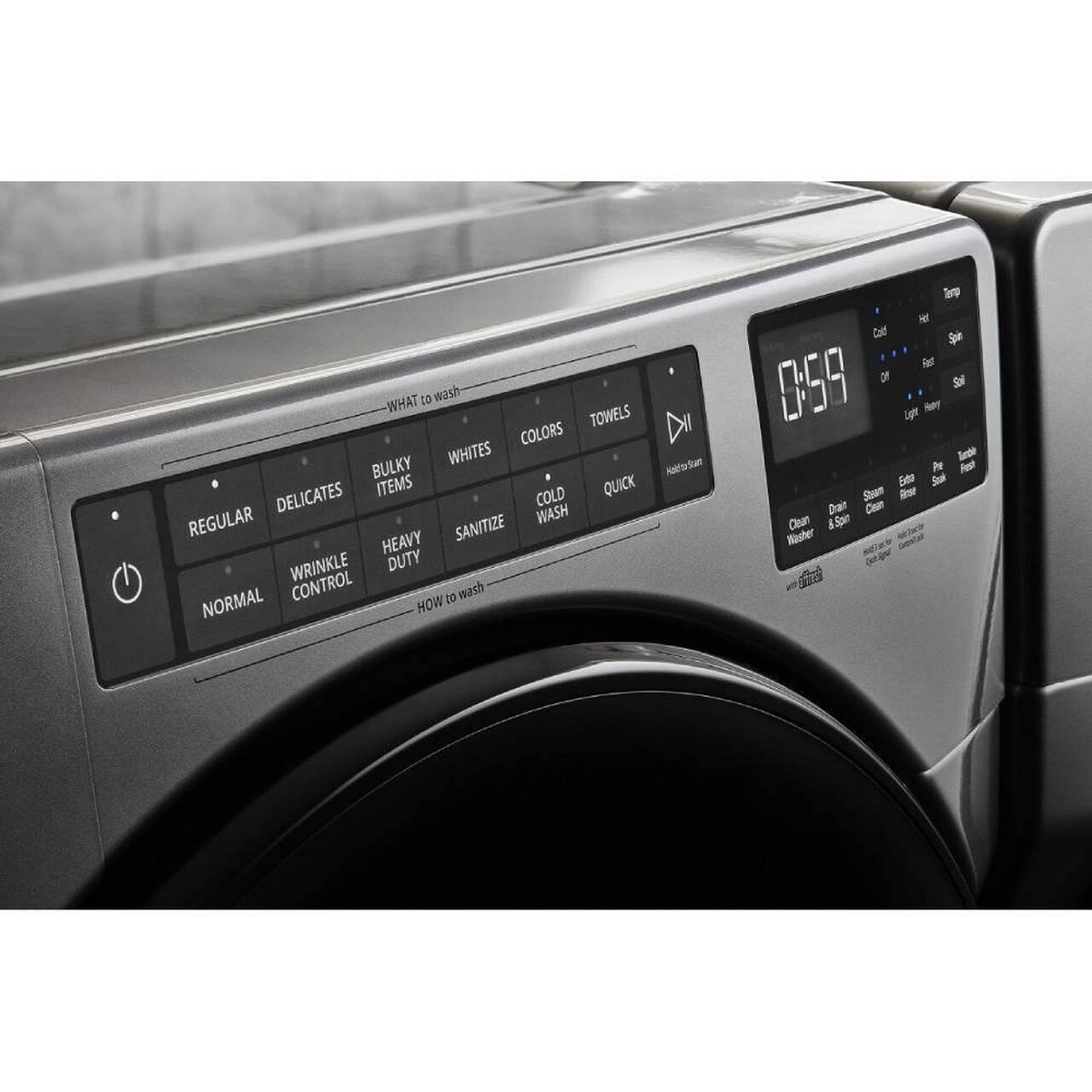Close-up of the washer console showing steam, sanitize and extra rinse options.