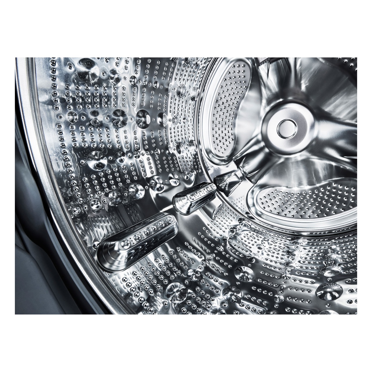 Close-up of stainless steel washer drum
