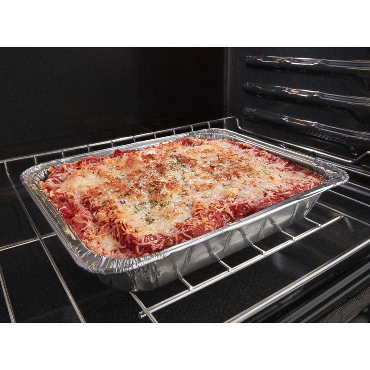 Frozen lasagna baking on an oven rack, illustrating Frozen Bake convenience.