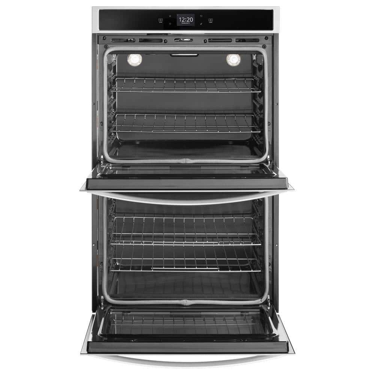 Open Whirlpool stainless double wall oven showing racks and interior lighting.