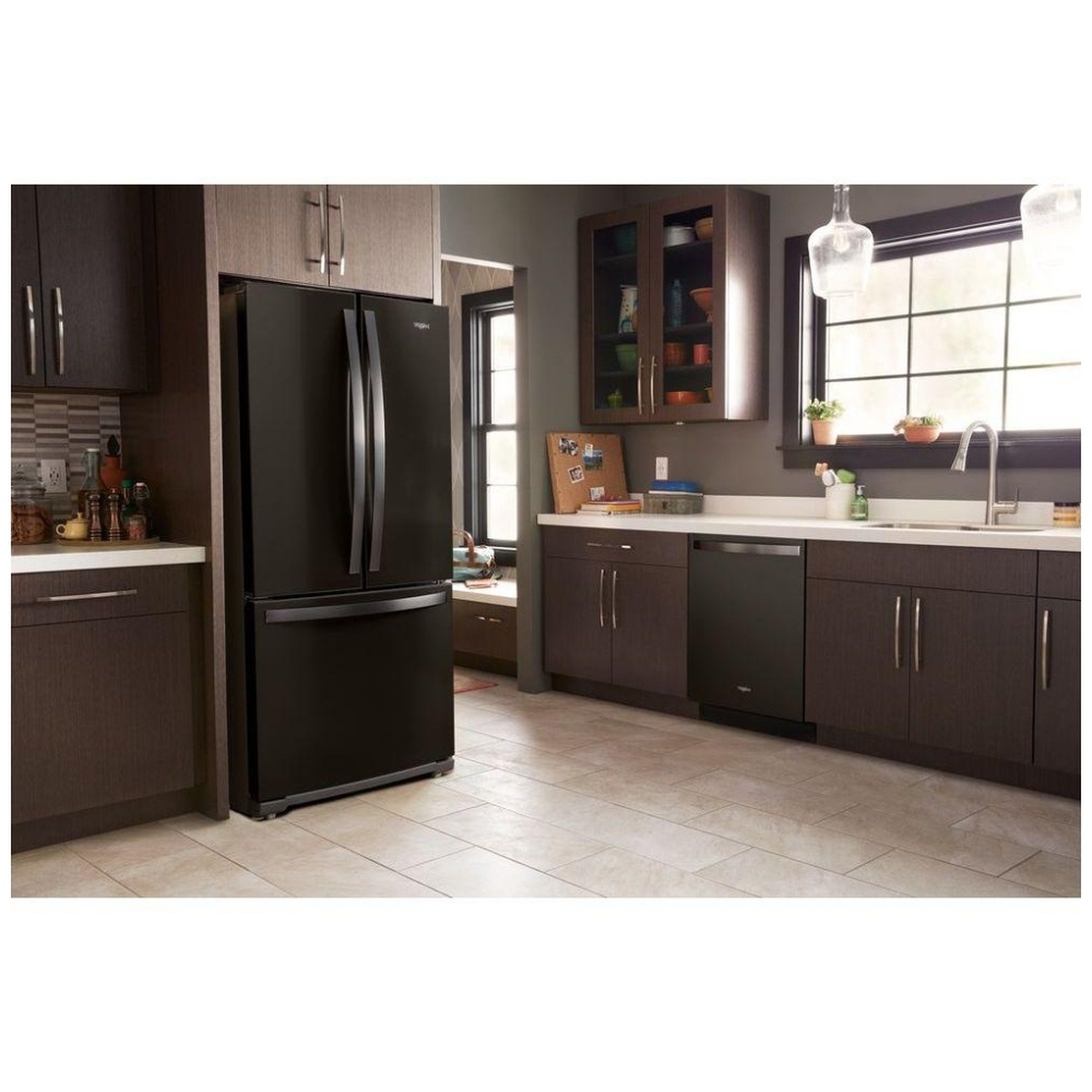 Whirlpool black stainless French door refrigerator installed in a modern kitchen.