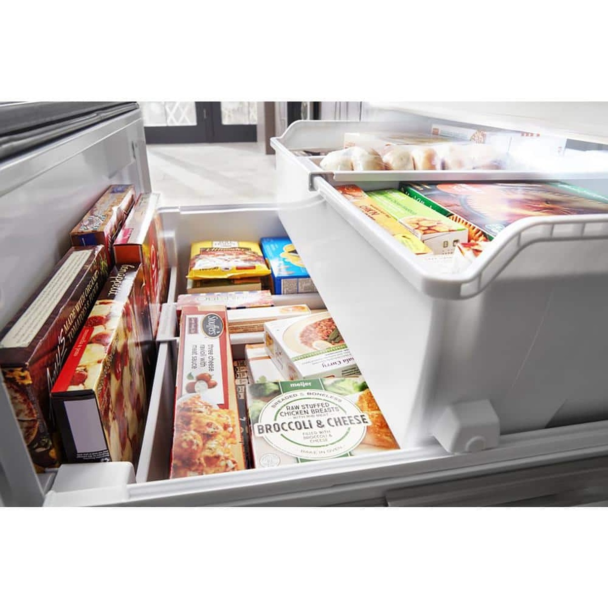 Two-tier freezer drawer with organized packaged foods