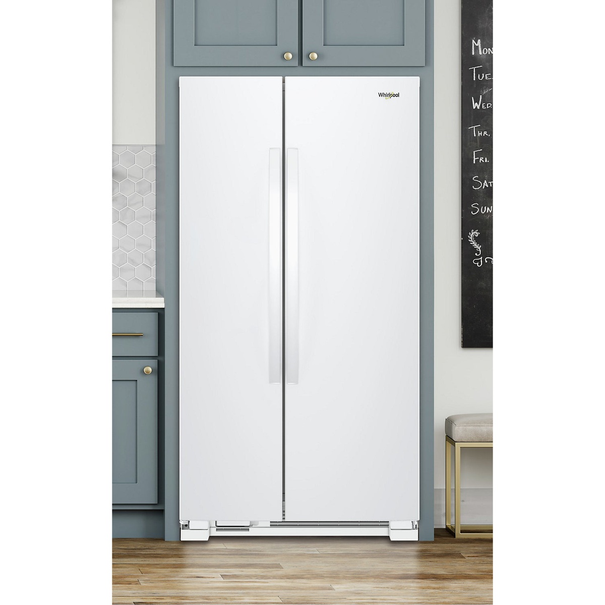 White Whirlpool side-by-side refrigerator installed in a kitchen alcove with hidden hinges