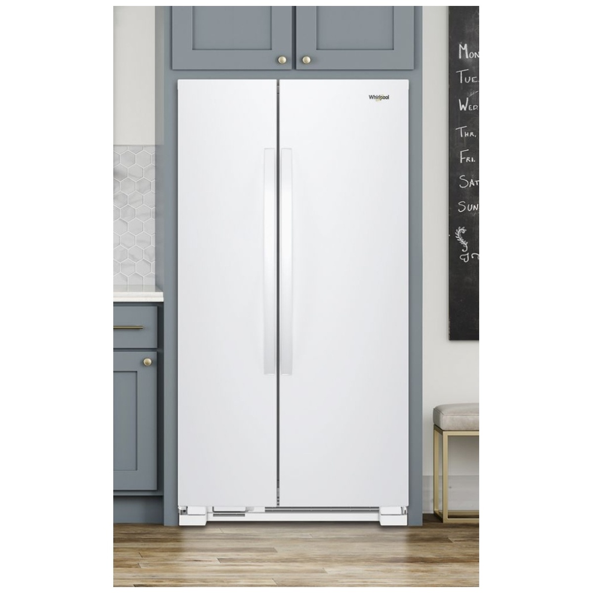 White Whirlpool side-by-side refrigerator installed in a modern kitchen.