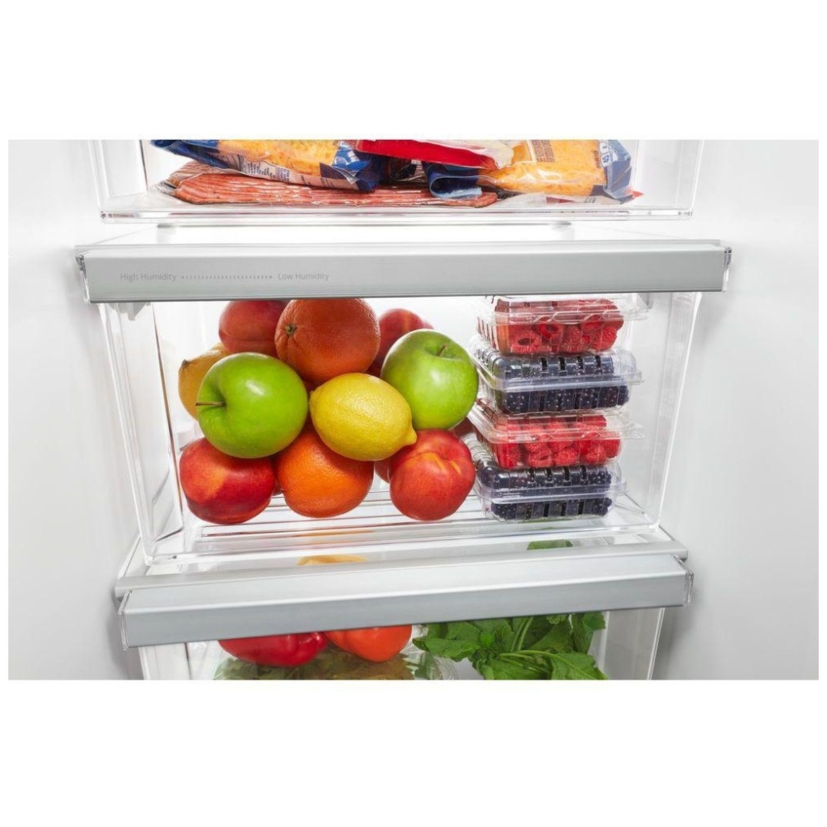 Close‑up of humidity‑controlled crisper drawer filled with fresh fruit.