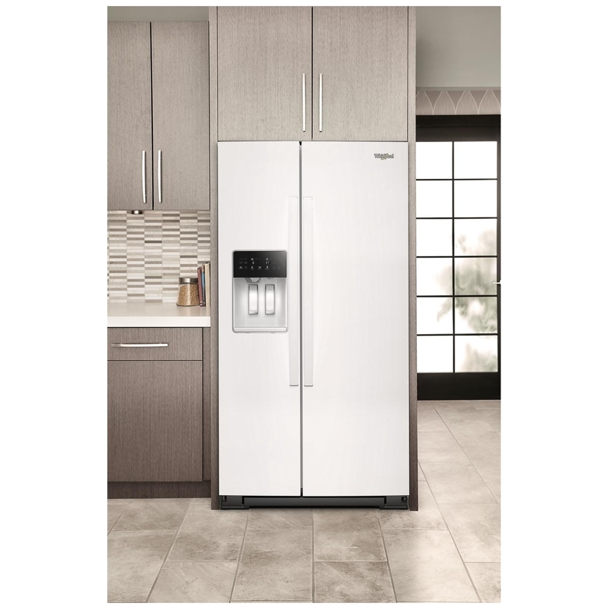 White Whirlpool side-by-side refrigerator installed flush with cabinetry in a modern kitchen.