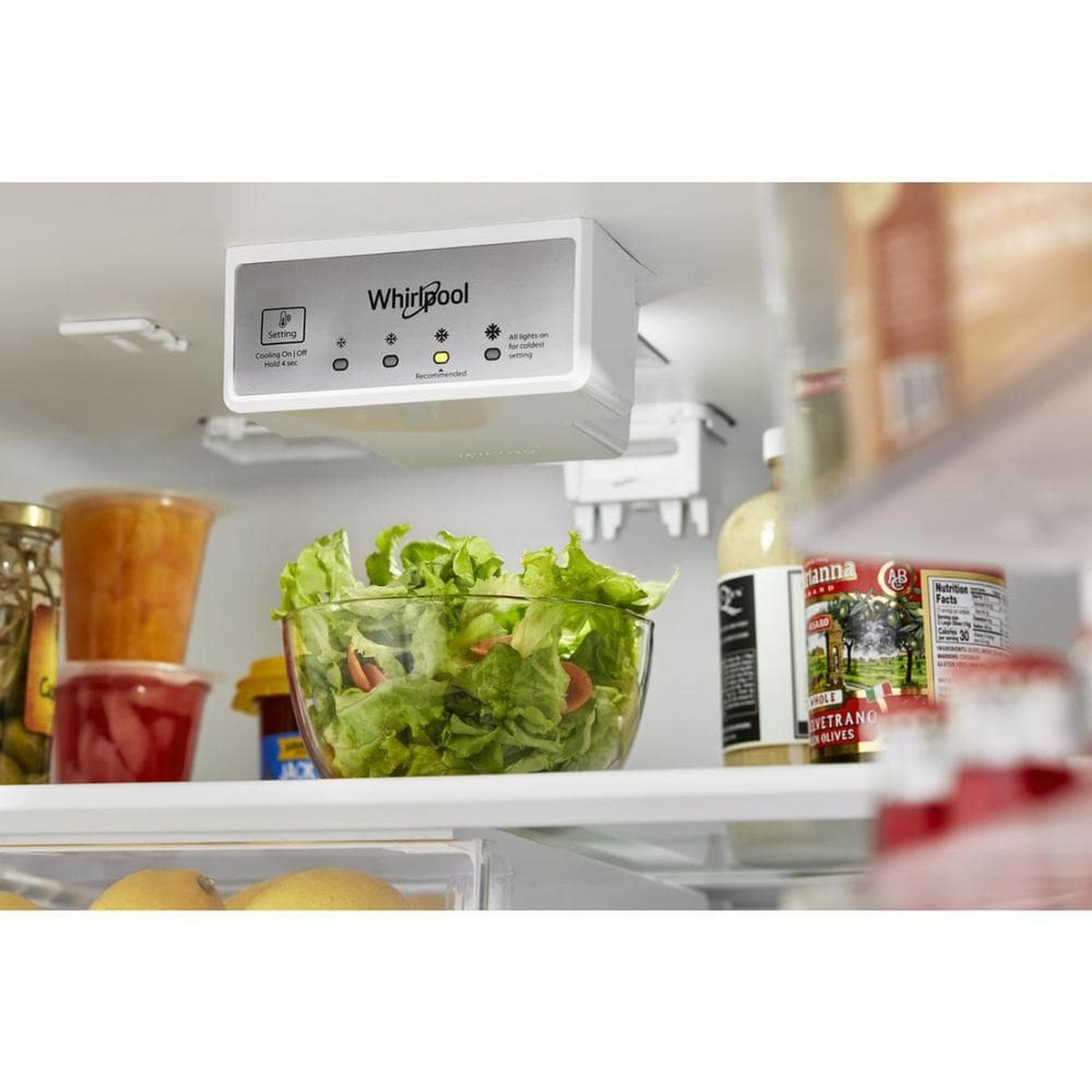 Close-up of electronic temperature control and LED lighting inside the fridge.