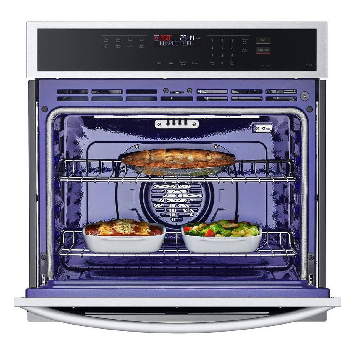 LG oven interior with multiple dishes on racks, illustrating multi-rack convection cooking.