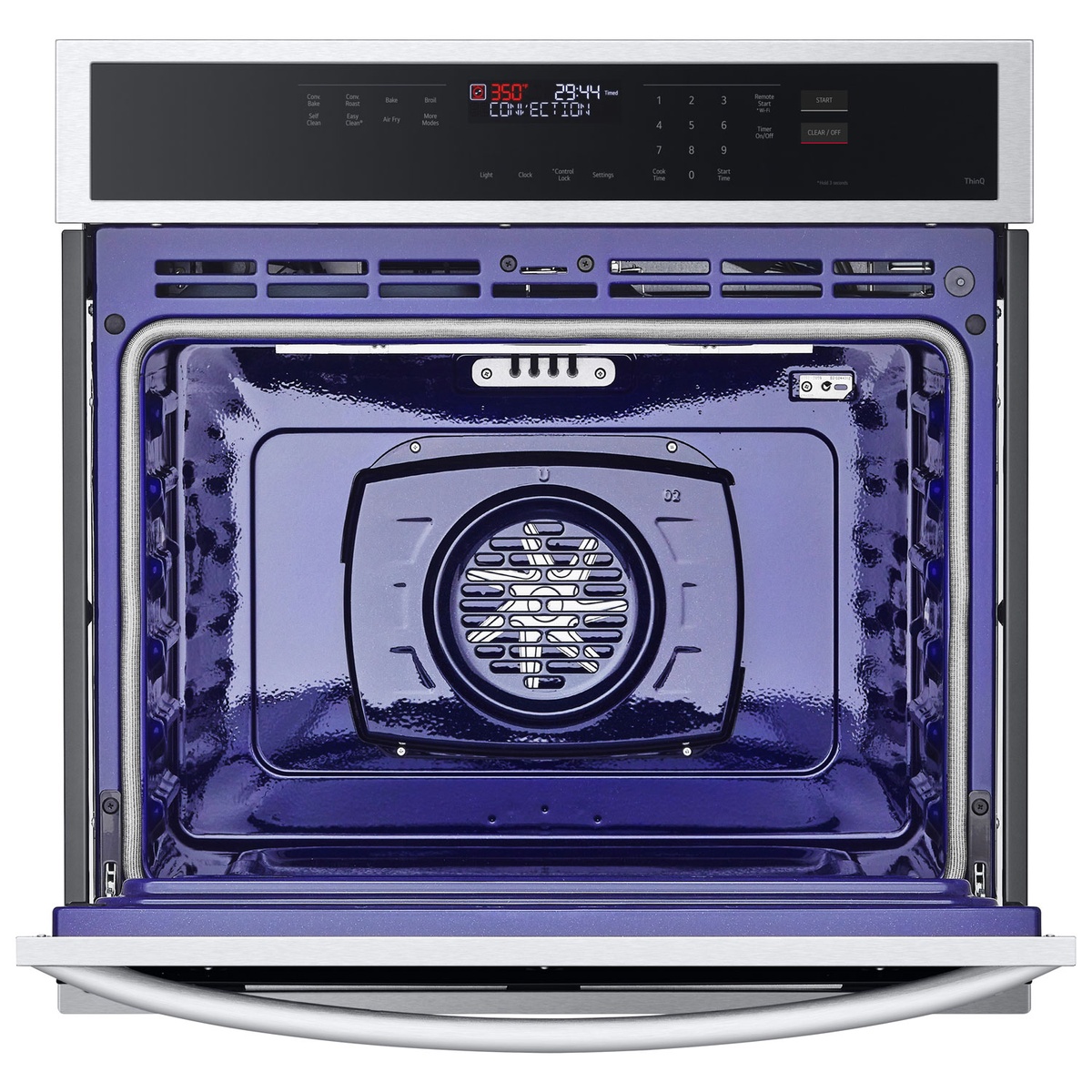 LG wall oven interior showing convection fan and purple enamel cavity.