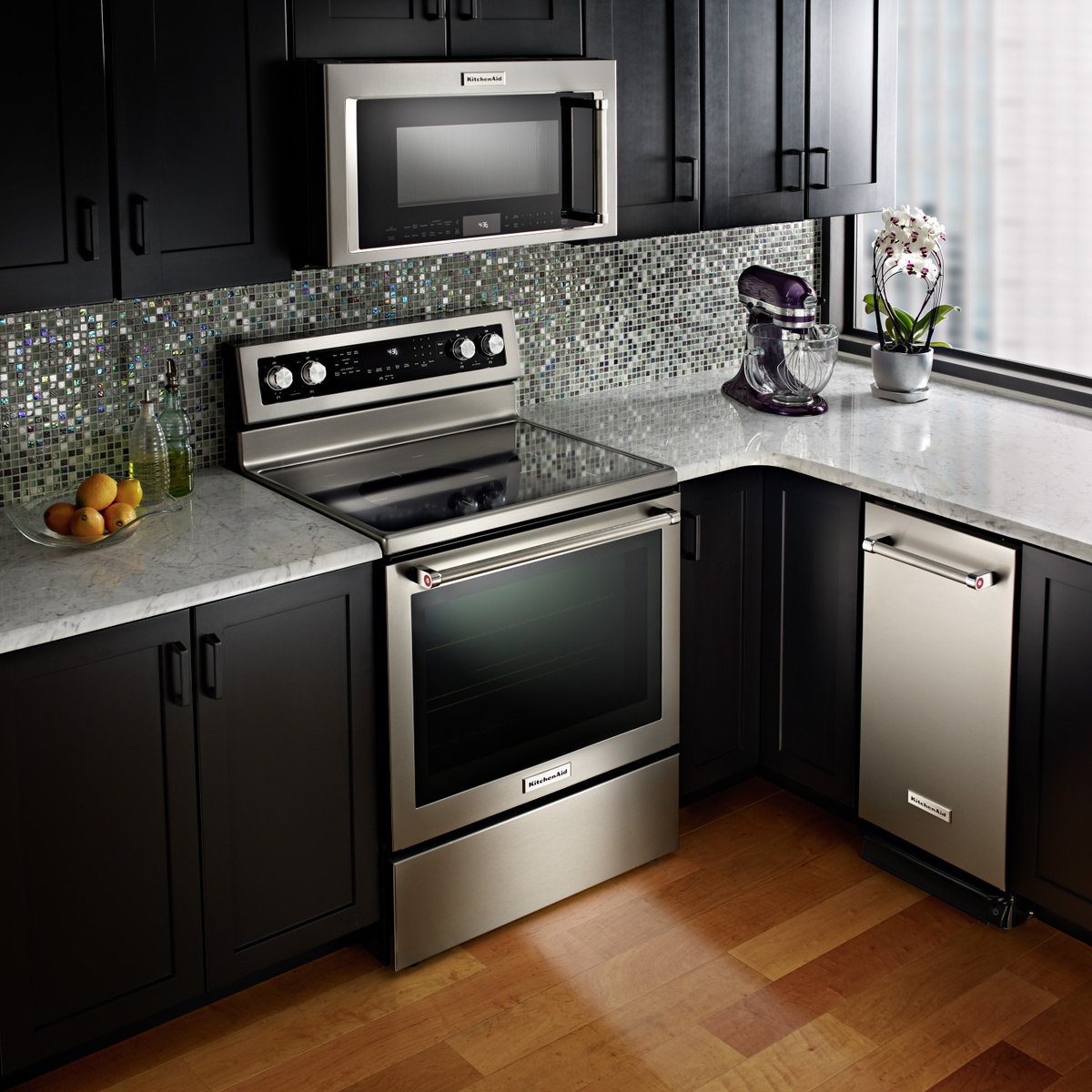 Freestanding electric range installed in a modern kitchen.