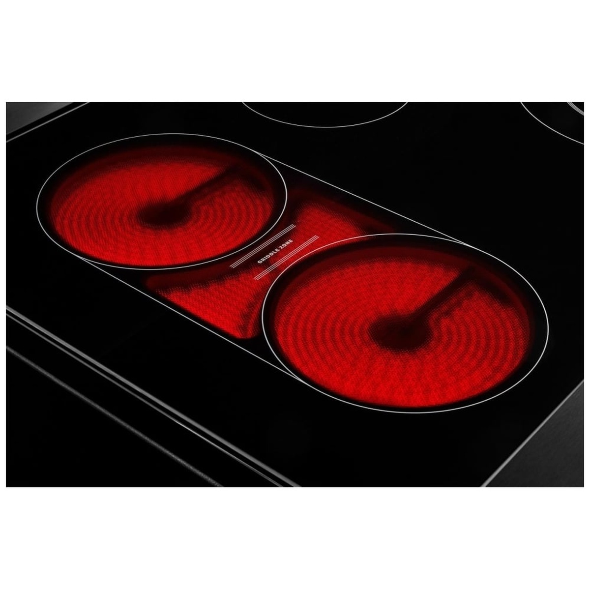 Close-up of dual radiant elements glowing red on the Maytag glass cooktop