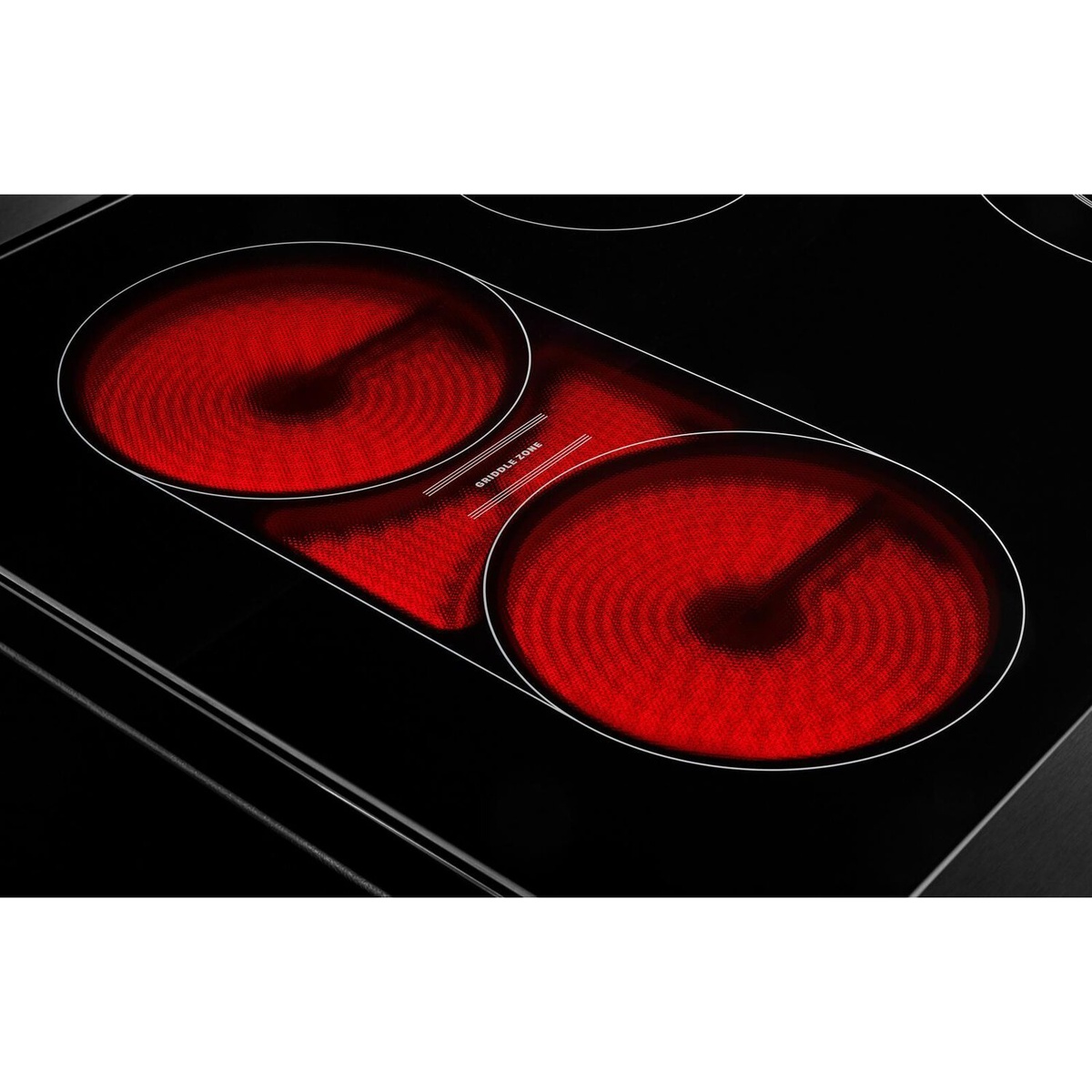 Close-up of illuminated bridge griddle zone on the ceramic cooktop