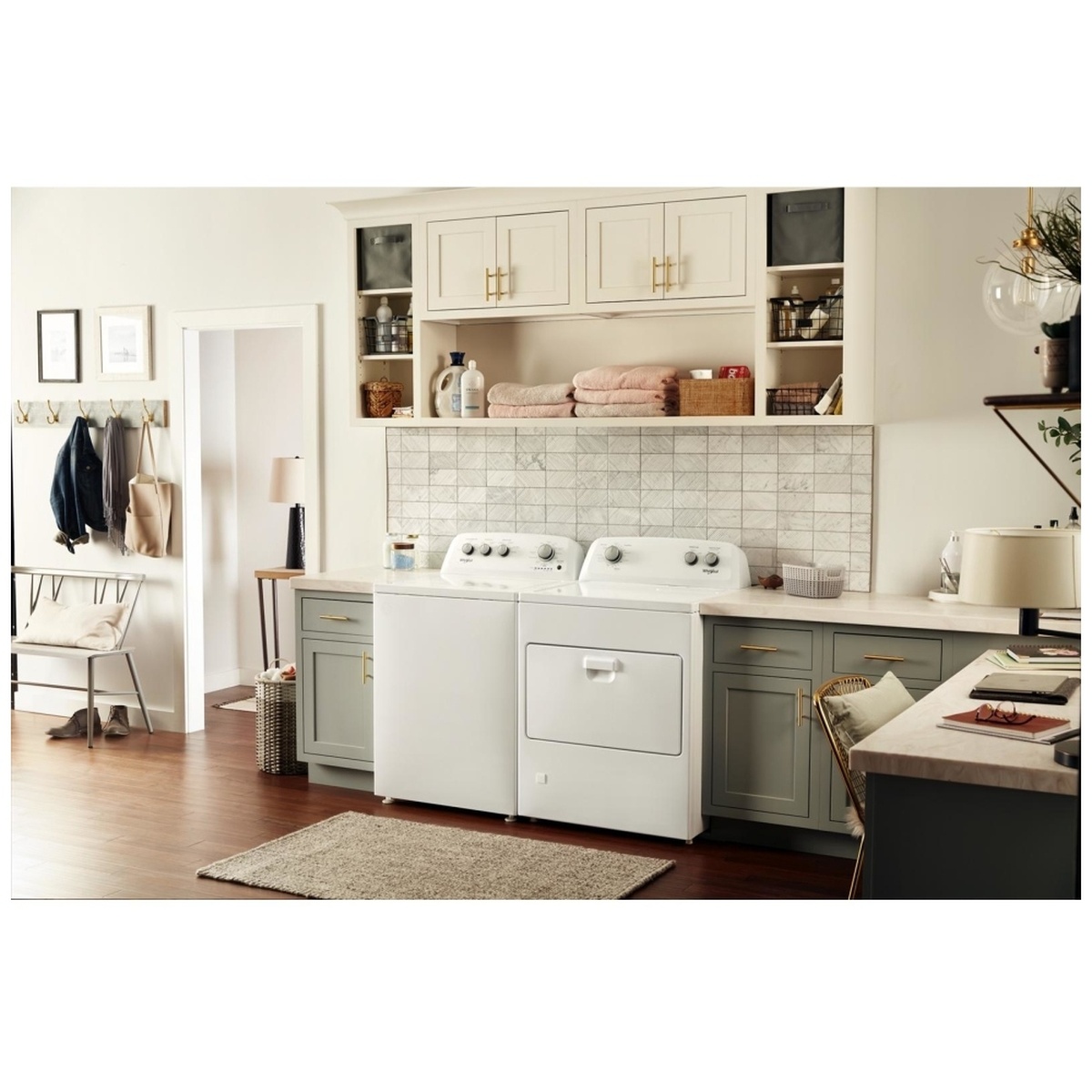Lifestyle laundry room with matching Whirlpool top-load washer and this dryer in a bright built-in space.