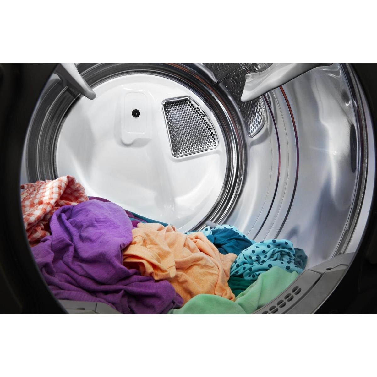 Clothes inside Whirlpool dryer drum highlighting moisture sensing and airflow vent