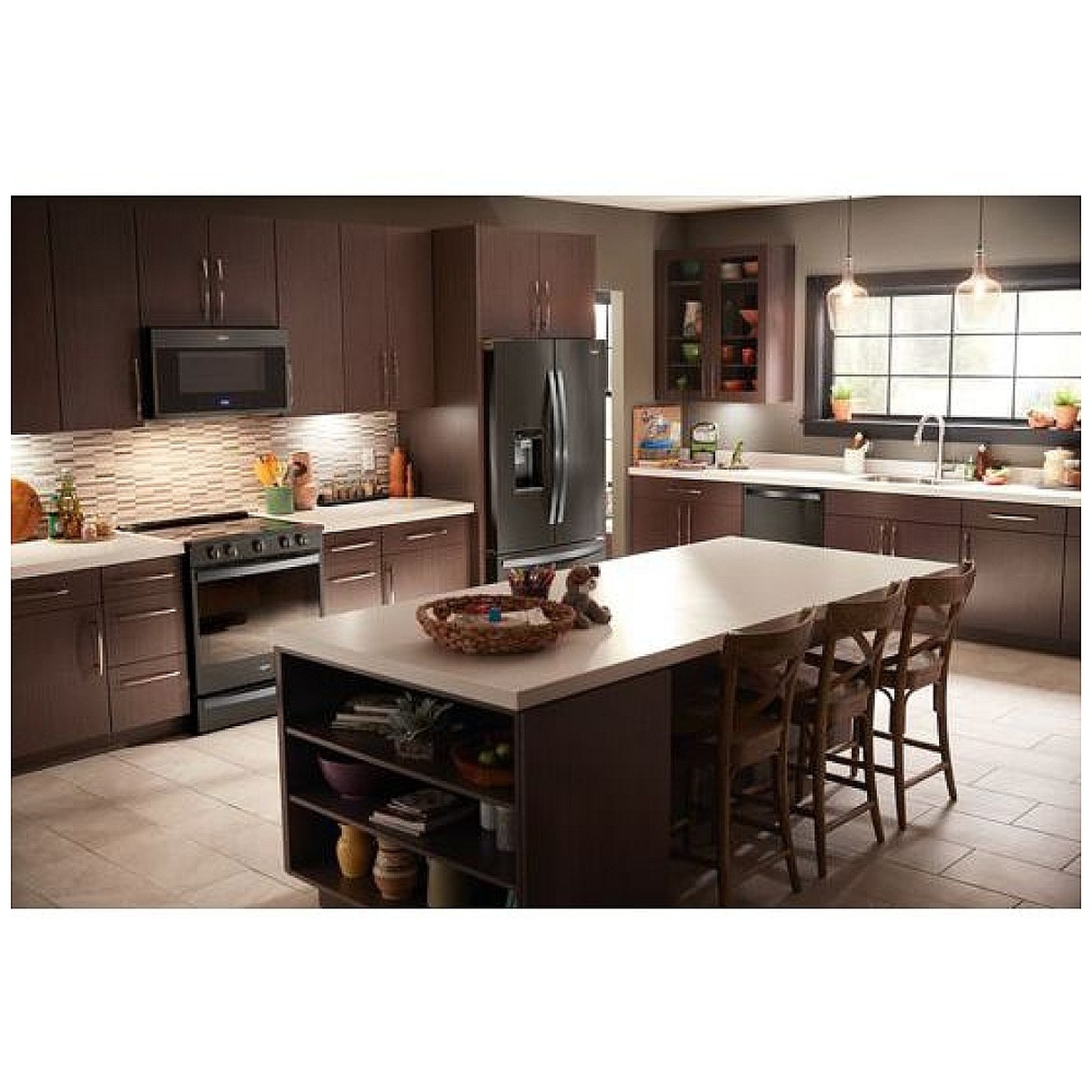 Lifestyle kitchen showing the range installed with matching black stainless appliances