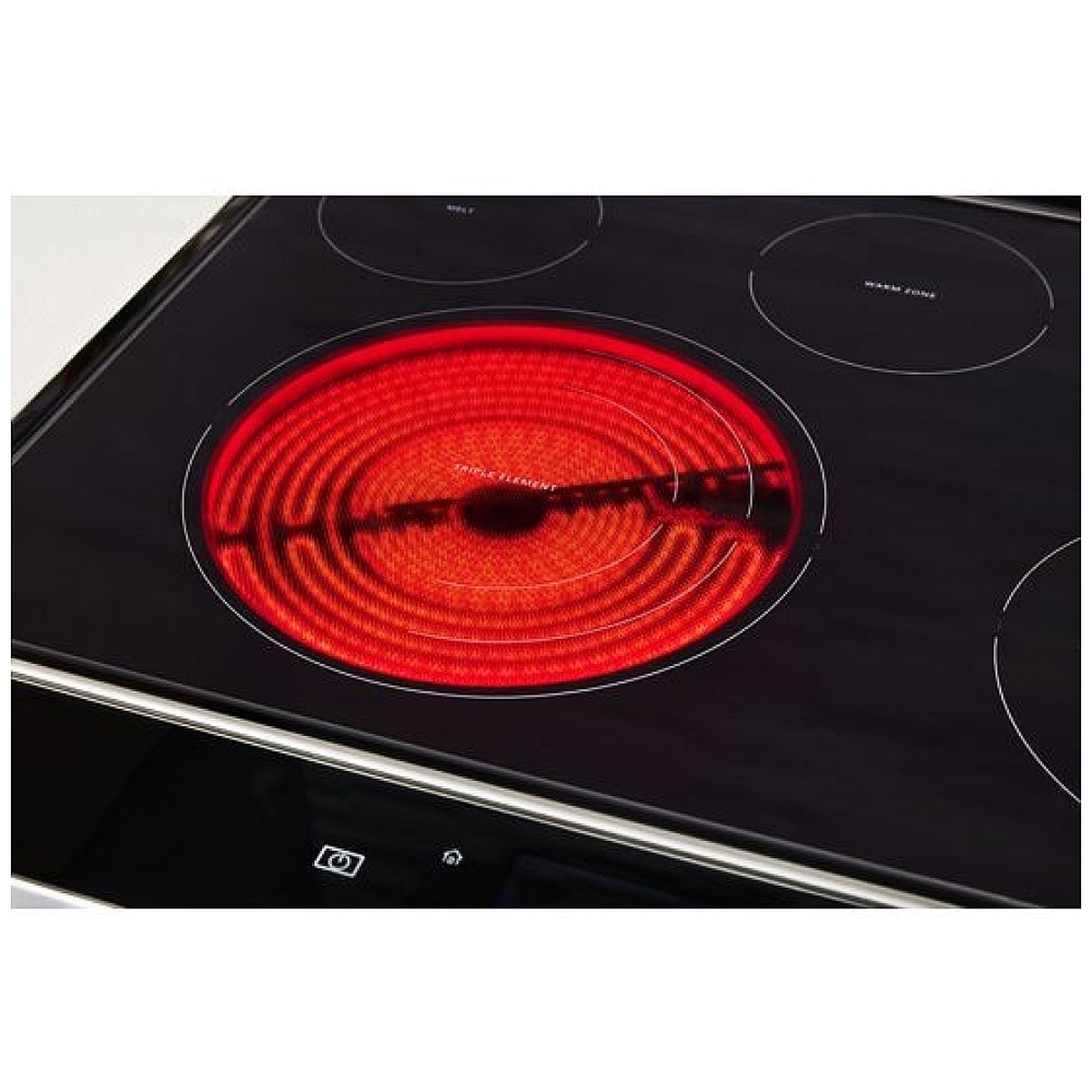 Close-up of the FlexHeat triple radiant element glowing on the ceramic cooktop