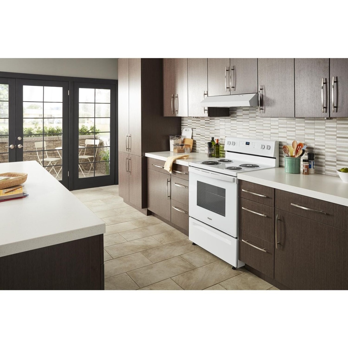 White Whirlpool electric range shown installed in a modern kitchen