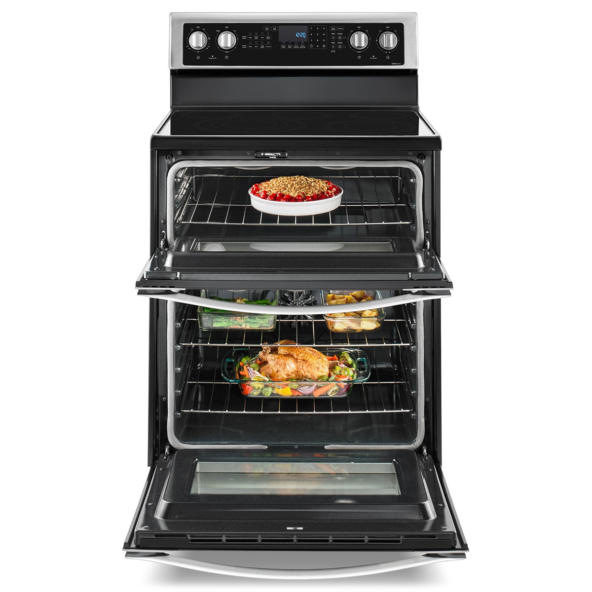 Whirlpool electric range with both oven doors open showing food inside