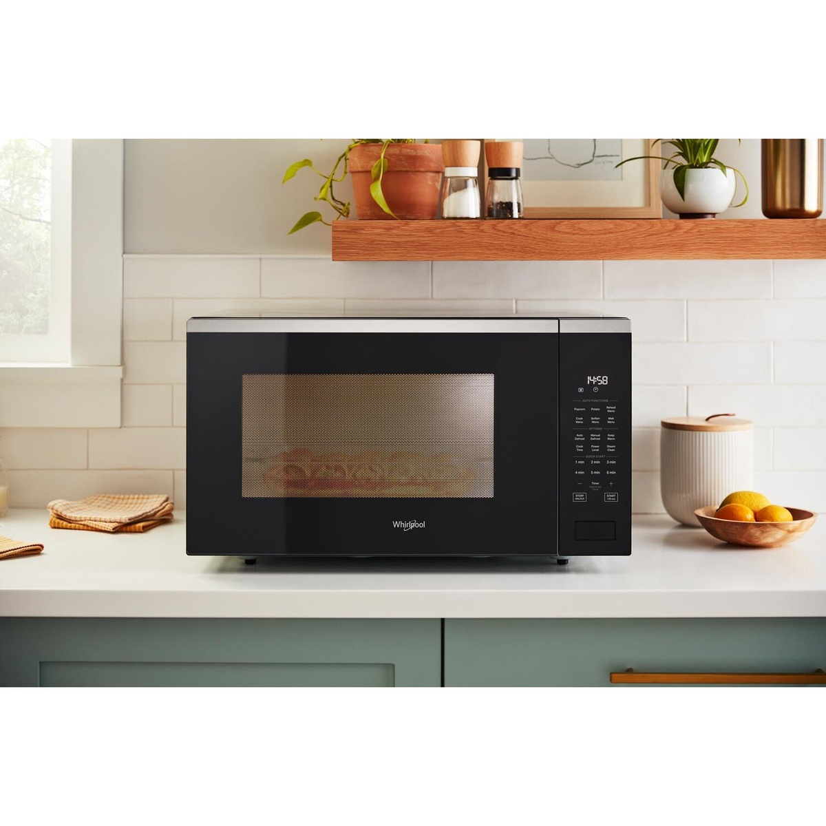 Microwave styled on a kitchen counter in use