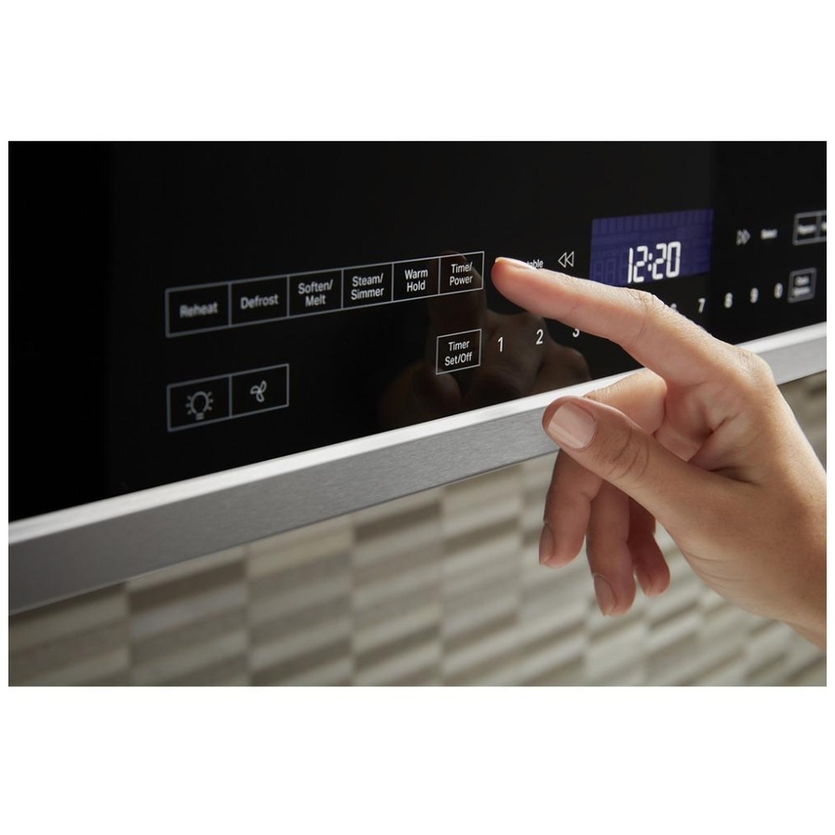 Close-up of a hand using tap-touch controls on the microwave front panel