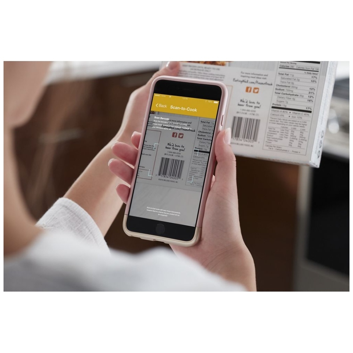 Phone using a Scan-to-Cook app to scan a package barcode in the kitchen.