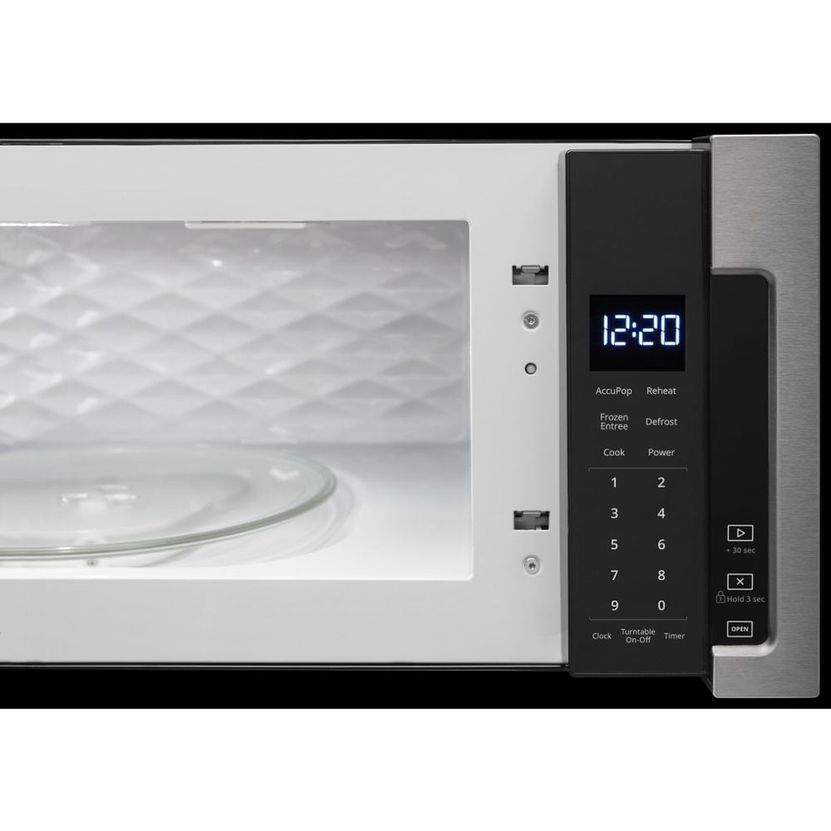 Close-up of concealed touch controls and interior turntable of the microwave.