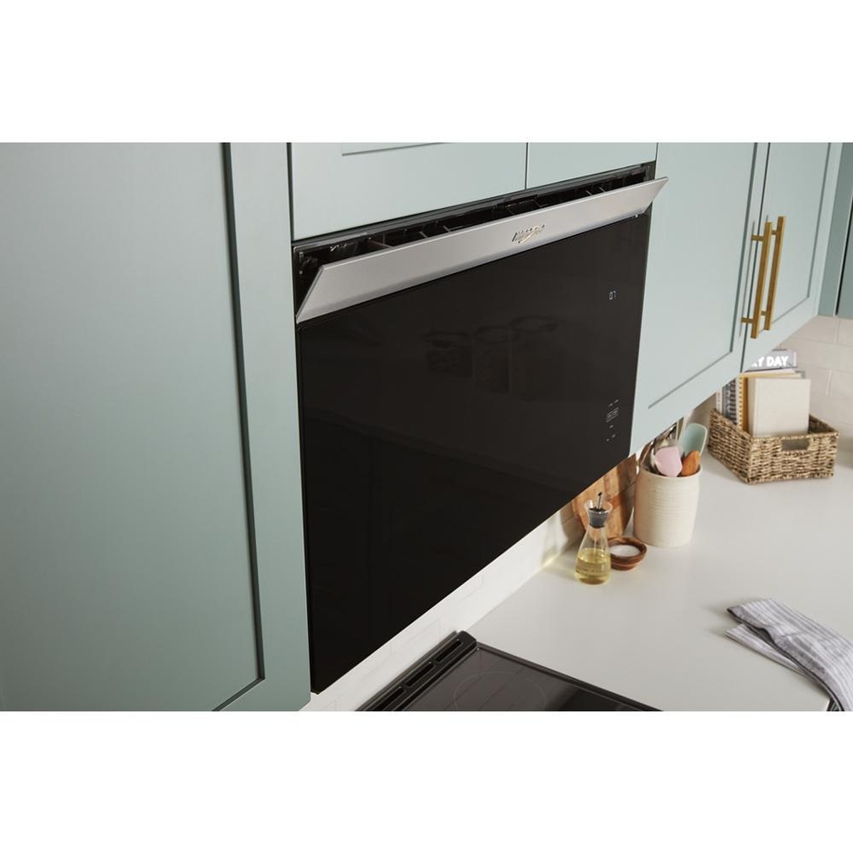 Hidden venting extending from the top of the microwave under cabinetry