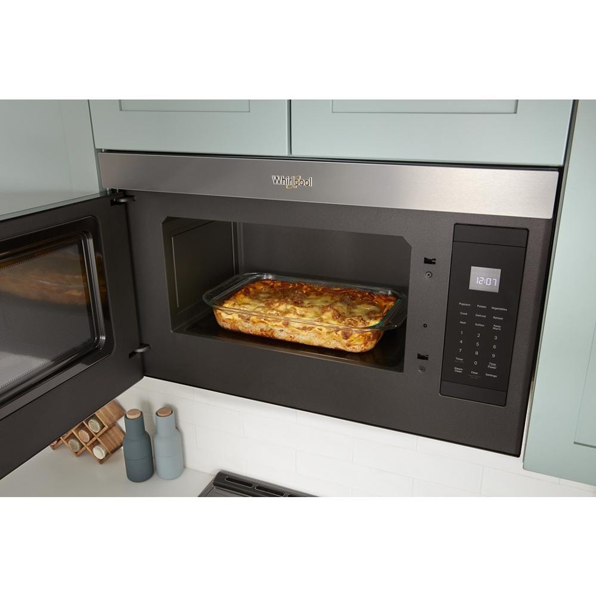 Microwave interior with a 13x9 casserole dish cooking