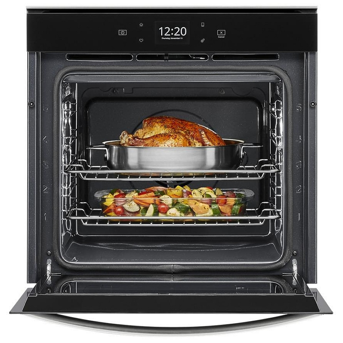 Open Whirlpool 24-inch wall oven cooking turkey and vegetables on two racks