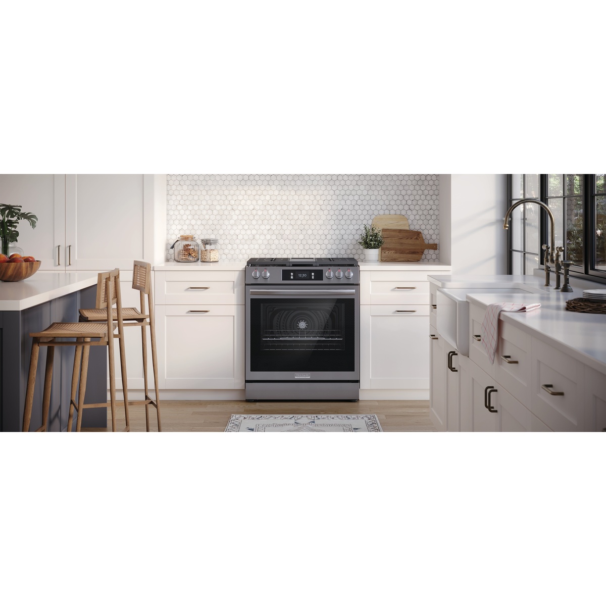 Frigidaire Gallery freestanding gas range installed between white cabinets in a bright kitchen
