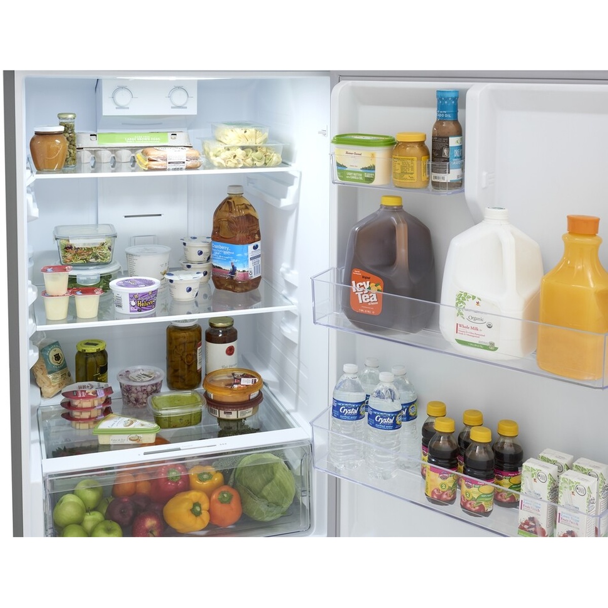 Close-up of the refrigerator interior and door bins with two dial temperature controls at the top