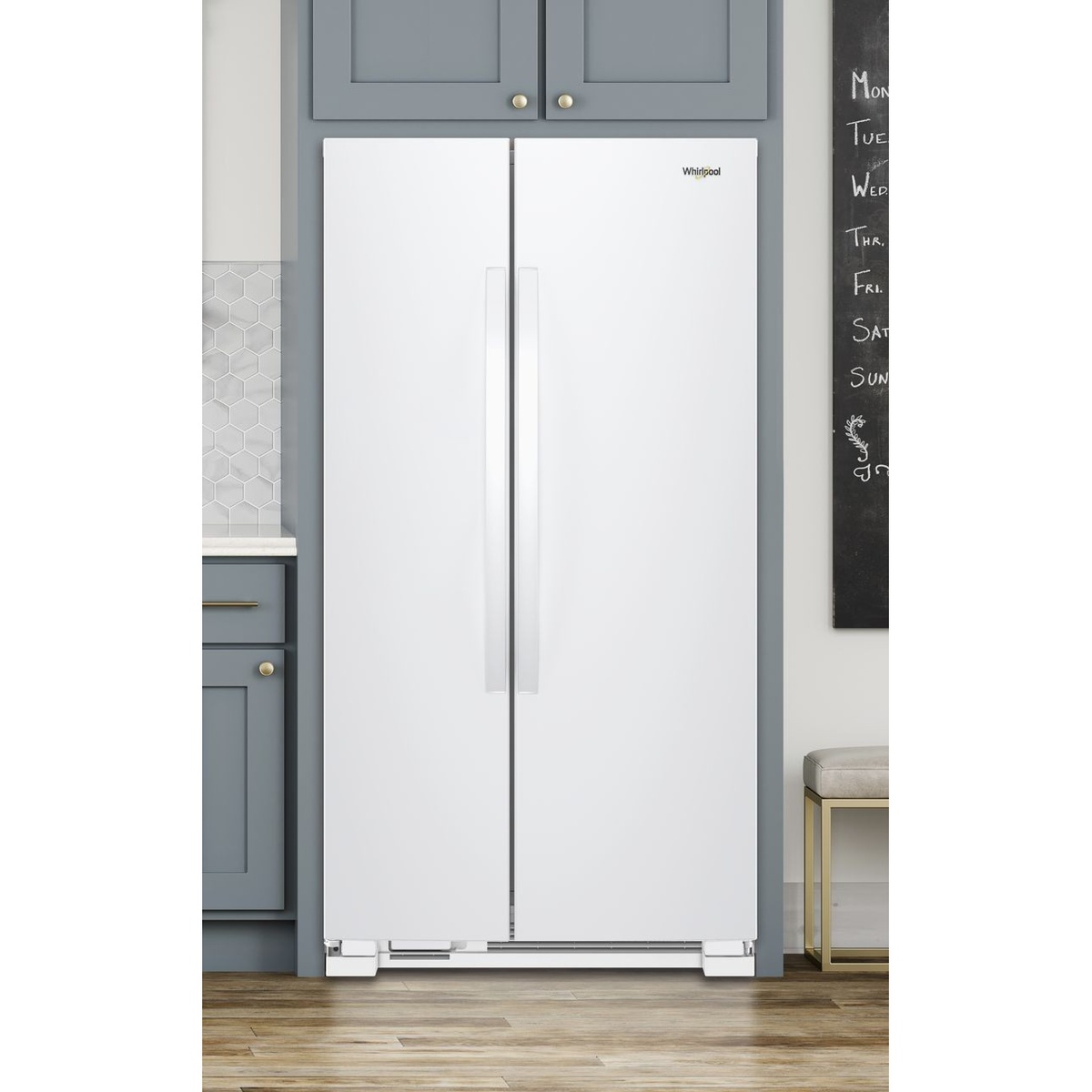 White Whirlpool side-by-side refrigerator installed in a kitchen with tall vertical handles and a clean, dispenser-free exterior